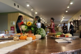 Women standing in the Interval House kitchen space