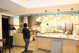 Someone standing in a kitchen